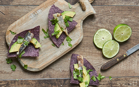 SMOKED WILD SARDINES ON BLUE CORN CHIPS